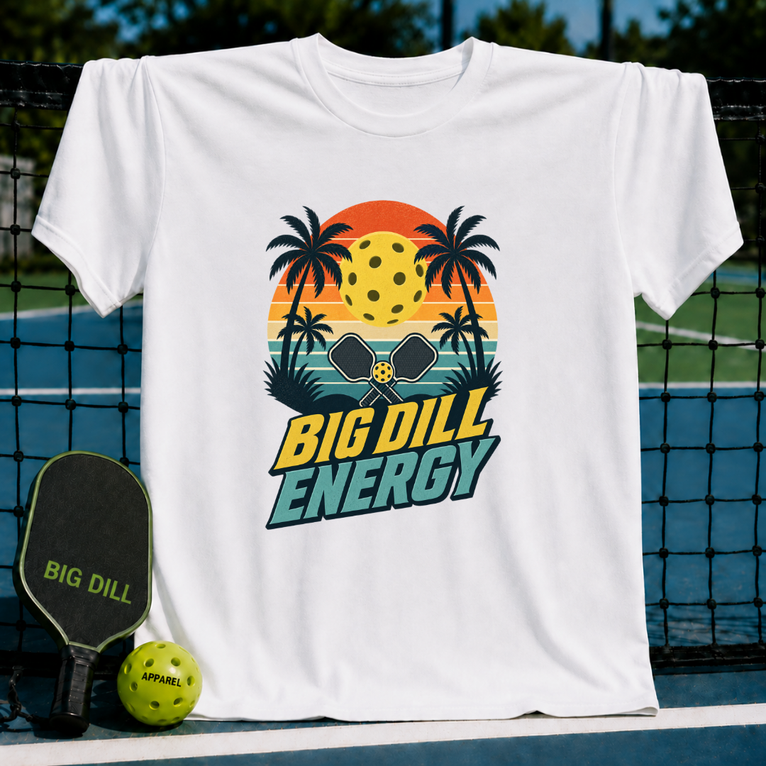 White crewneck t-shirt featuring a retro sunset, palm trees, and pickleball graphic with Big Dill Energy text.