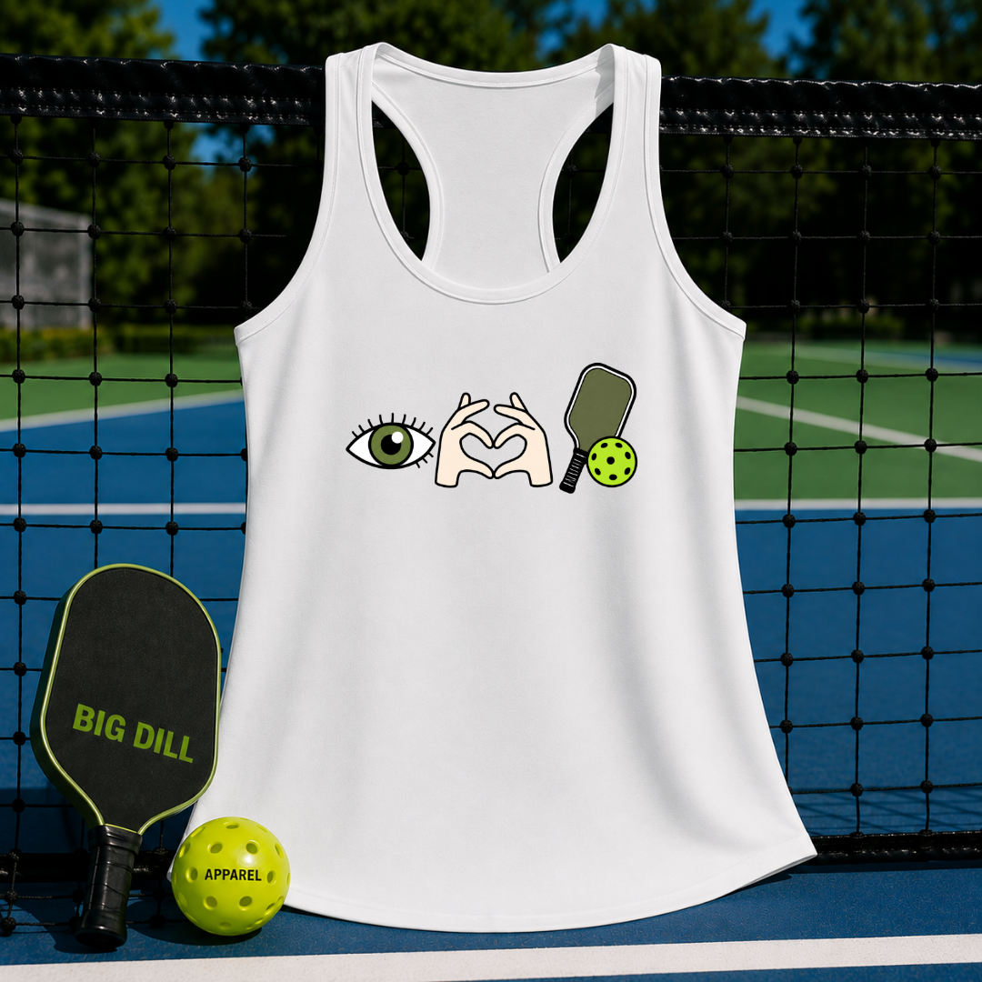 White racerback tank top featuring an eye, heart hands, and pickleball paddle graphic on a pickleball court background.