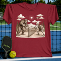 Maroon unisex t-shirt featuring a vintage-style graphic of Bigfoot and an alien playing pickleball on a court.