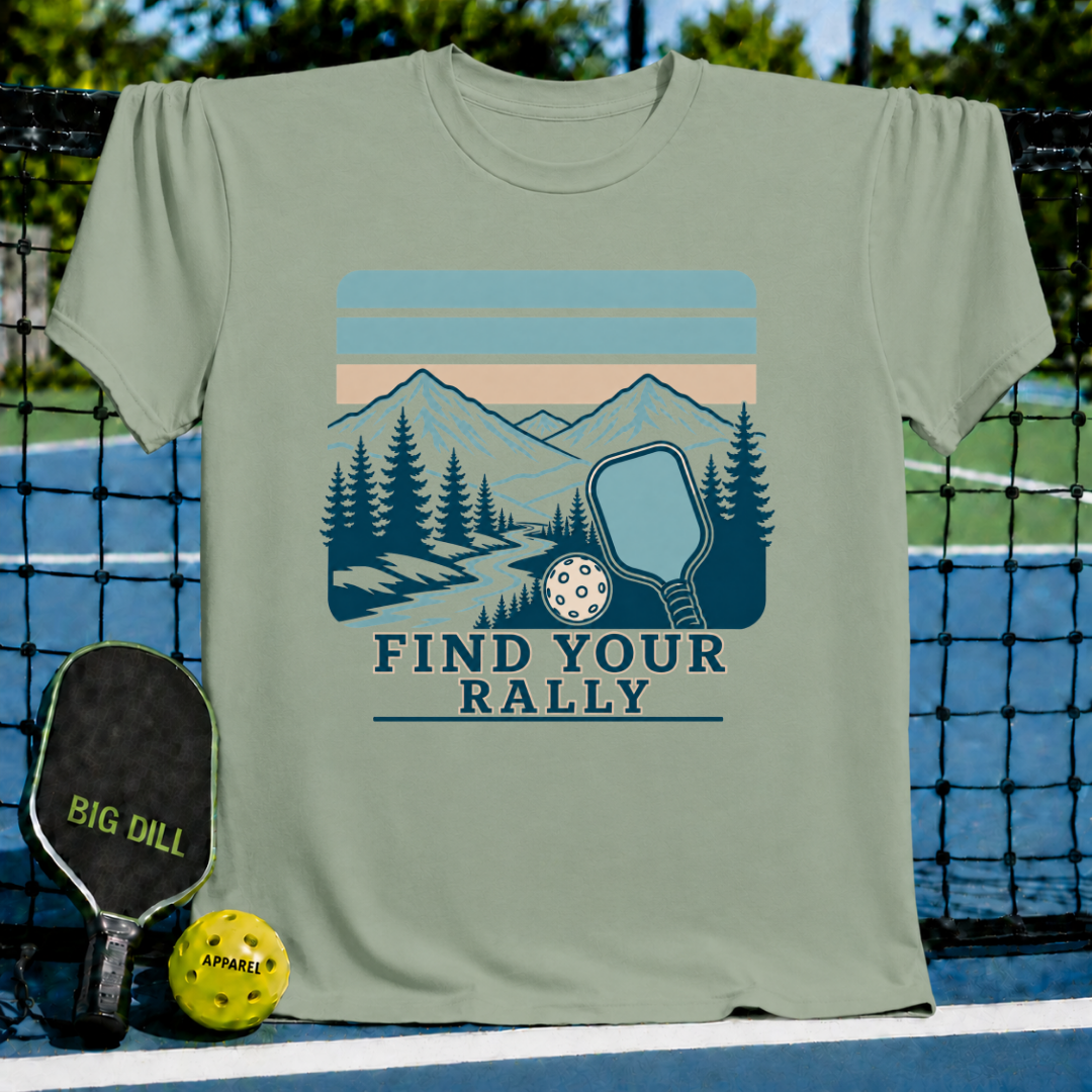 Sage green crewneck t-shirt featuring a vintage mountain and pickleball graphic with the text Find Your Rally.