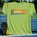 Lime green unisex t-shirt featuring a retro graphic of a pickleball paddle, yellow ball, and colorful motion stripes.