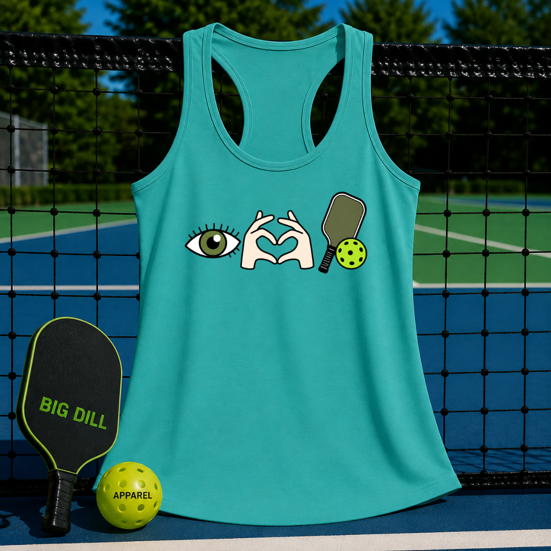 Teal racerback tank top featuring an eye, heart hands, and pickleball graphic, displayed on a pickleball court net.