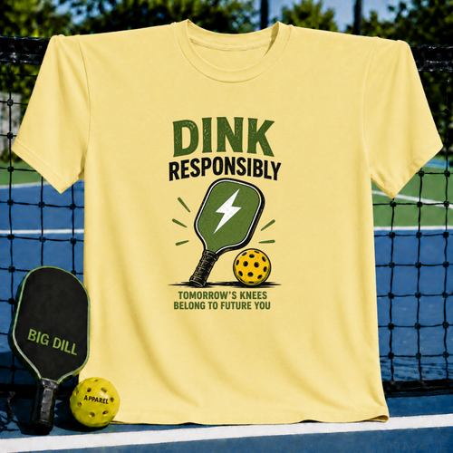 Bright yellow unisex t-shirt featuring a distressed green pickleball paddle and ball graphic with Dink Responsibly text.