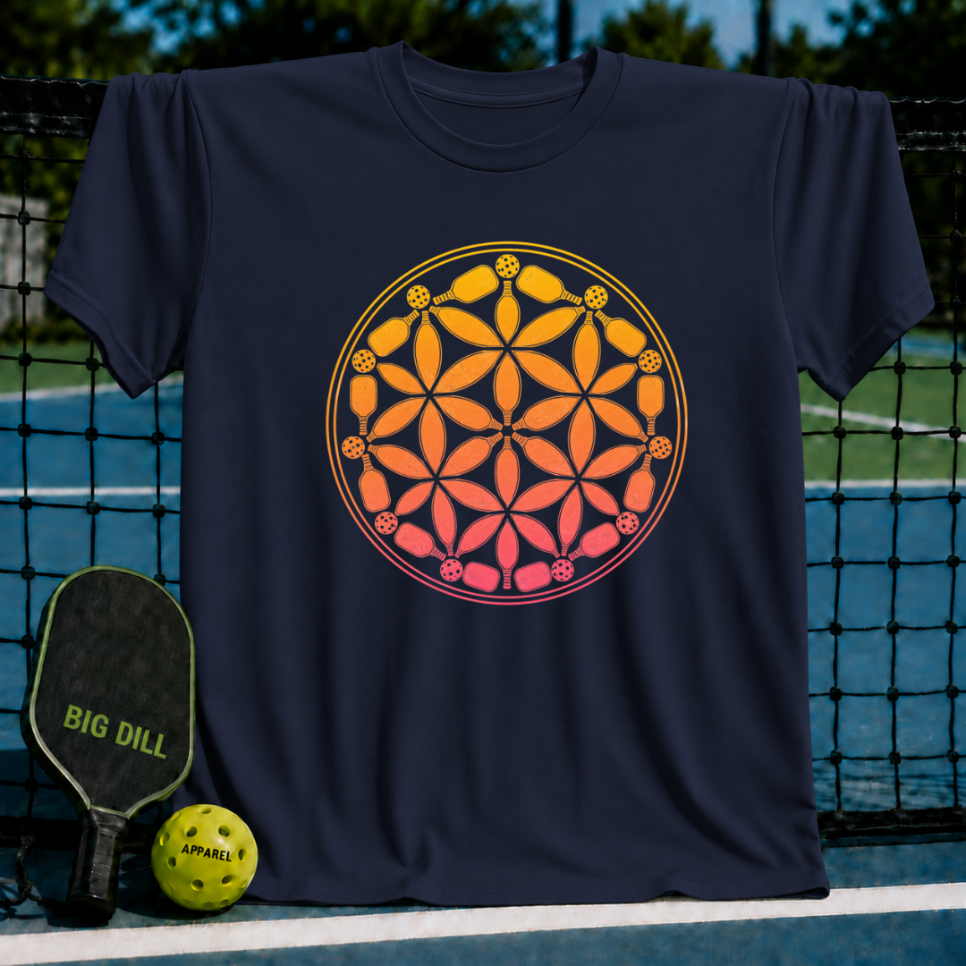 Navy blue t-shirt featuring a vibrant orange and pink Flower of Life design made of pickleball paddles and balls.