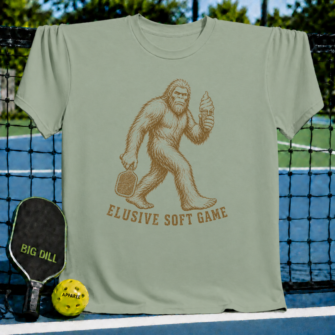 Sage green unisex t-shirt featuring a vintage Sasquatch graphic holding a pickleball paddle and a melting ice cream cone.