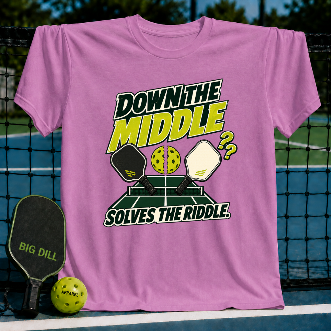 Pink cotton t-shirt featuring a Down the Middle pickleball graphic with paddles, a split ball, and court design.