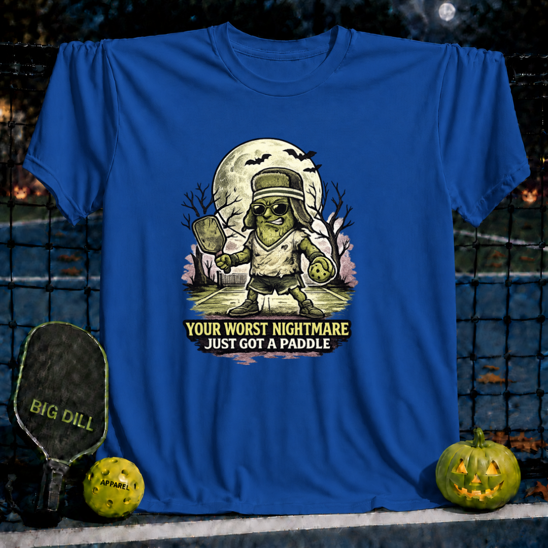 Royal blue unisex t-shirt featuring a spooky pickleball-playing monster graphic with the text Your Worst Nightmare Just Got A Paddle.
