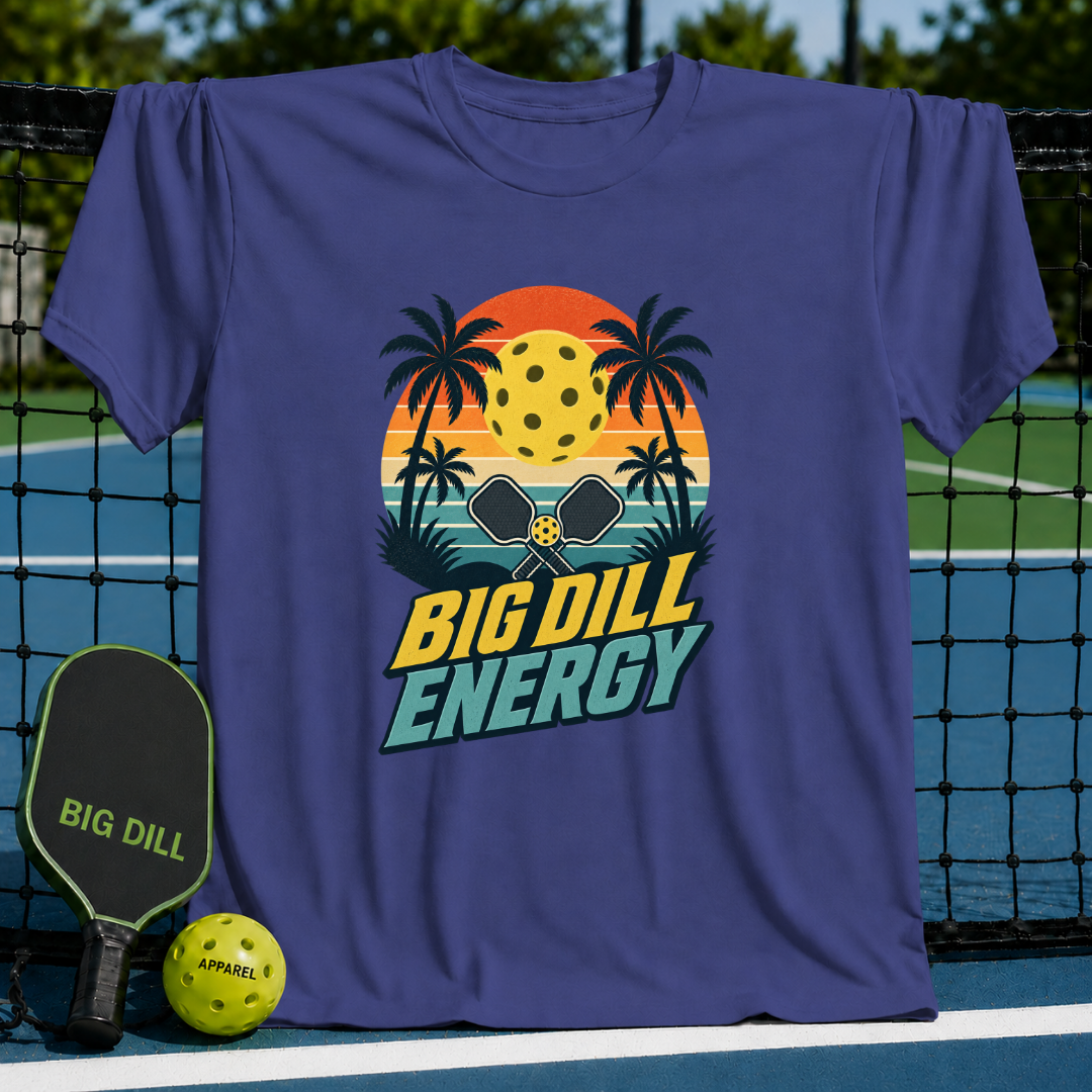 Purple crewneck t-shirt featuring a retro sunset, palm trees, pickleball paddles, and Big Dill Energy text graphic.