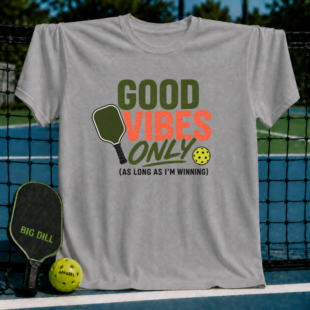 Grey unisex t-shirt featuring olive and rust Good Vibes Only text with a pickleball paddle and ball graphic.