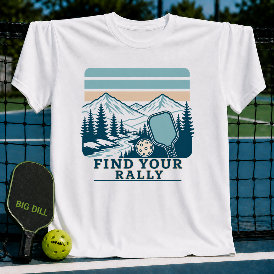 White cotton t-shirt featuring a retro mountain landscape, pickleball paddle, and ball graphic with Find Your Rally text.