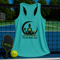 Teal racerback tank with a Pickleball Zen yoga graphic, displayed on a pickleball court with a paddle and ball.