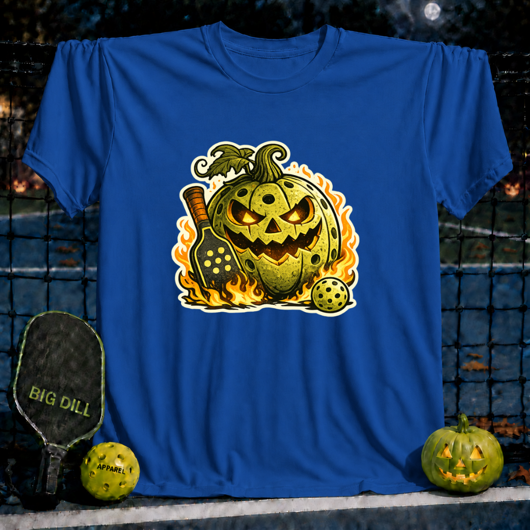 Royal blue unisex pickleball t-shirt featuring a flaming jack-o'-lantern pumpkin with a pickleball paddle and ball graphic.
