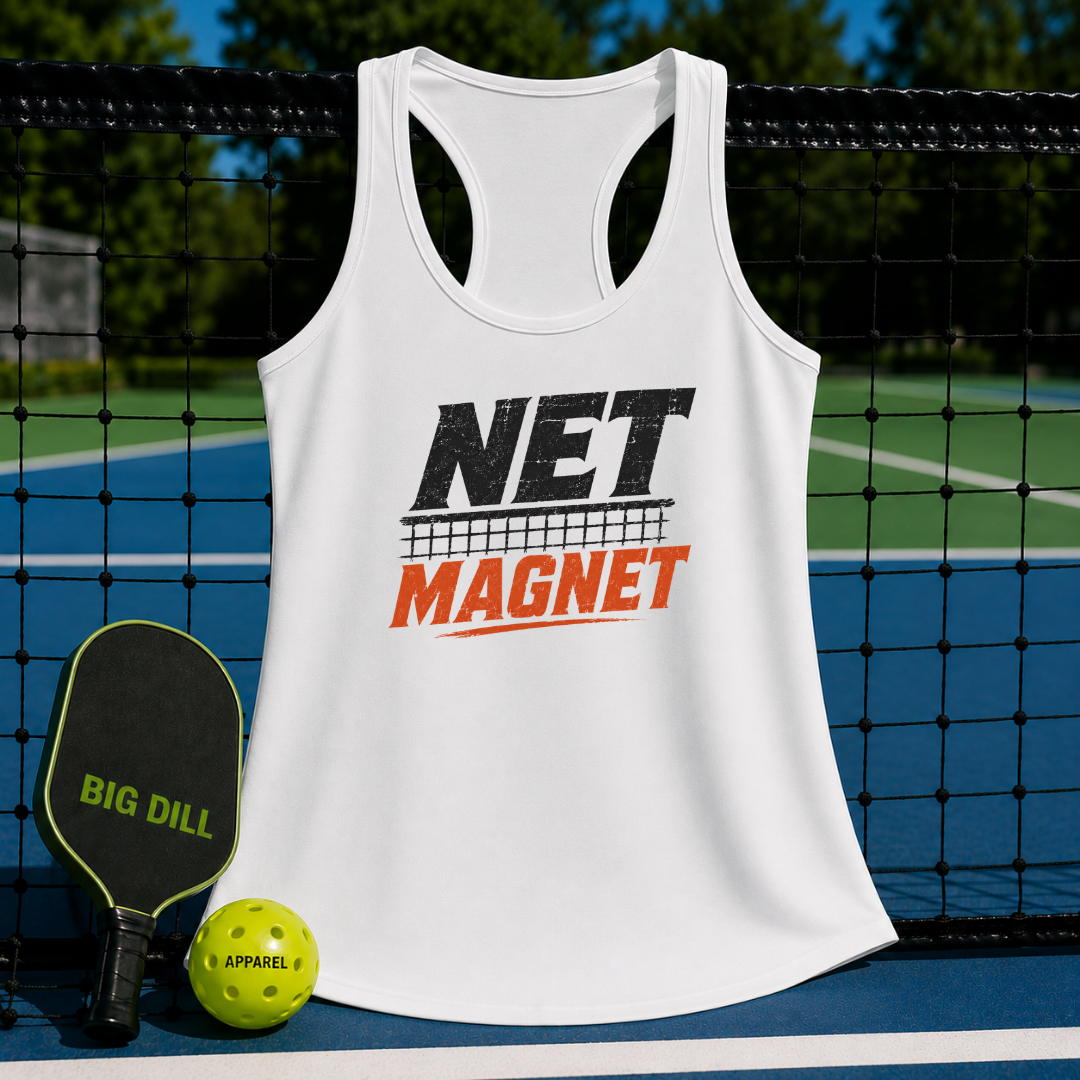 White racerback tank top with Net Magnet graphic hanging on a pickleball net with a paddle and ball.