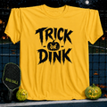 Daisy yellow unisex t-shirt featuring black Trick or Dink Halloween text and a pumpkin graphic on a pickleball court.