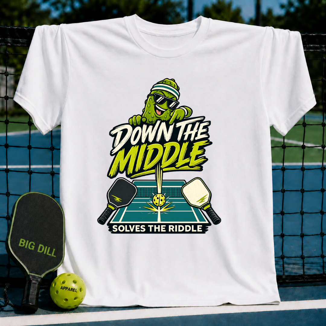 White crew neck t-shirt featuring a pickleball-themed graphic with a cartoon pickle, paddles, and court design.