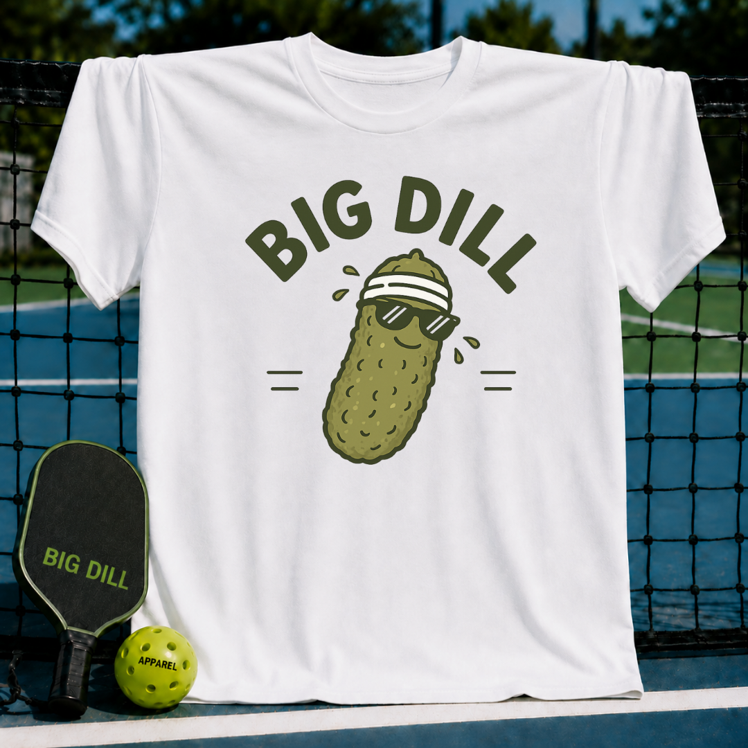 White unisex t-shirt featuring a graphic of a pickle wearing sunglasses and a sweatband with the text Big Dill.
