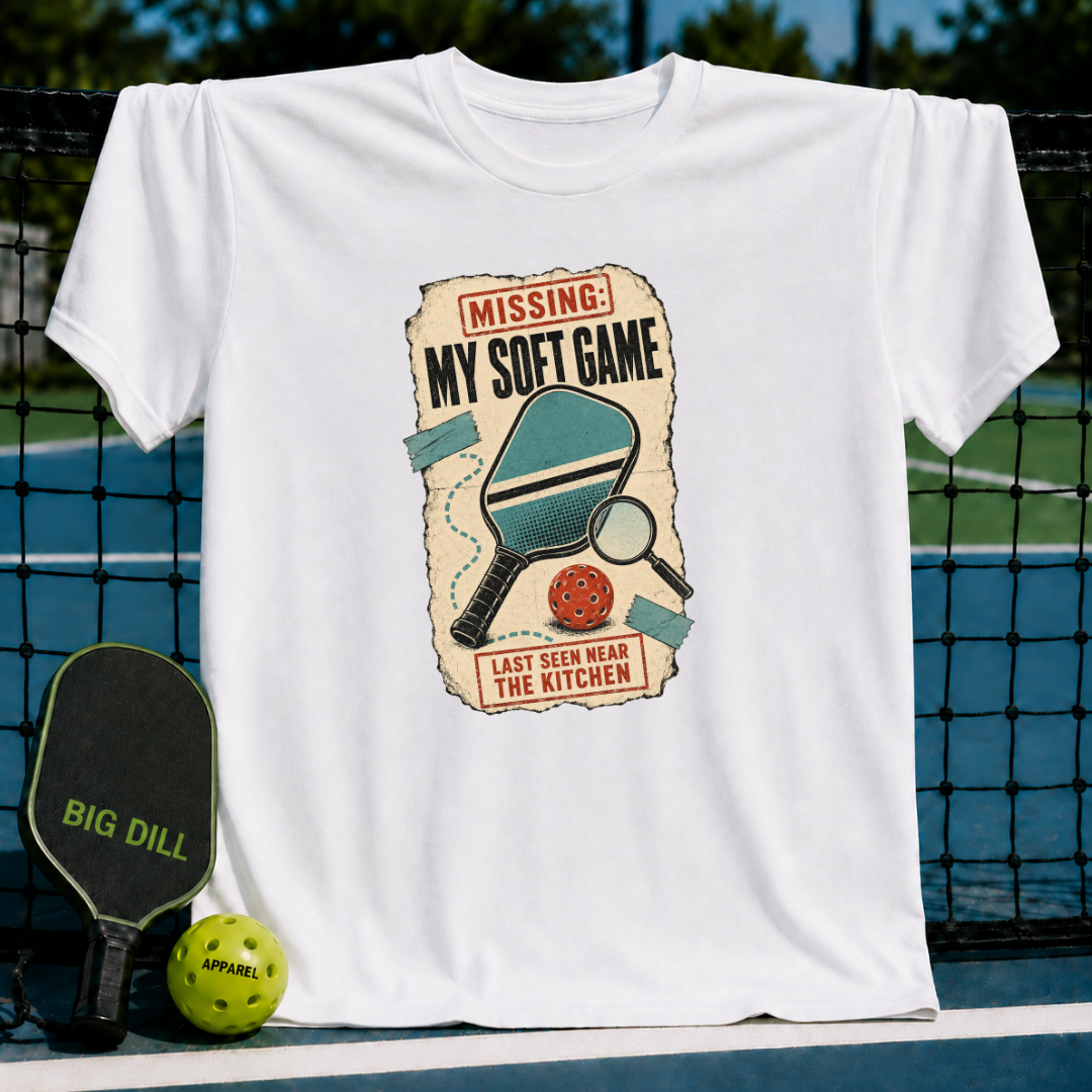 White crewneck t-shirt featuring a vintage-style Missing My Soft Game pickleball graphic on a court background.