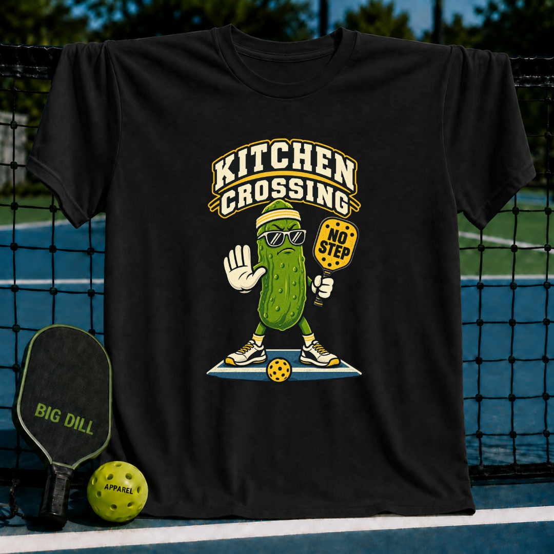 Black cotton t-shirt featuring a graphic of a pickle wearing sunglasses and holding a No Step pickleball paddle.