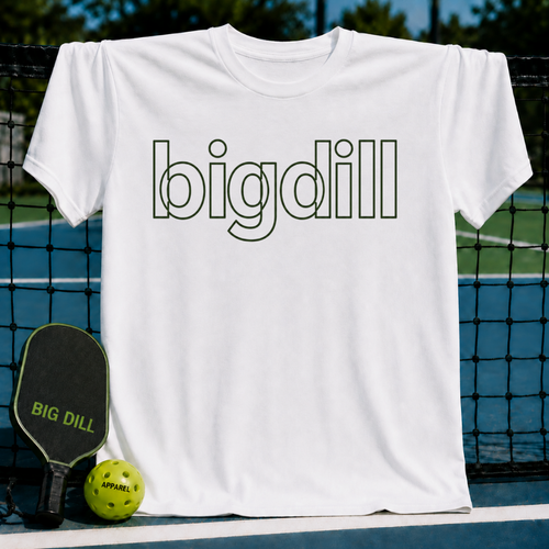 White unisex t-shirt featuring a bold, green outline "bigdill" wordmark, displayed on a pickleball court with paddle and ball.