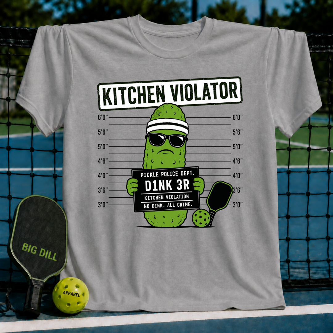 Grey t-shirt featuring a pickle character in sunglasses holding a mug shot sign that reads Kitchen Violator and D1NK 3R.
