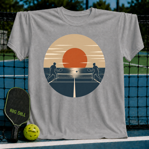 Grey unisex t-shirt featuring a retro sunset graphic of two people playing pickleball on a court.