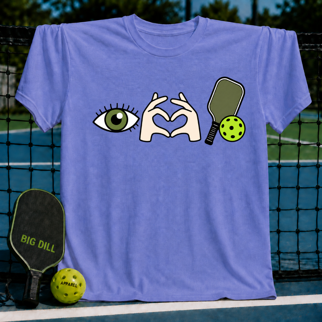 Periwinkle blue crewneck t-shirt featuring an eye, heart-shaped hands, and pickleball paddle graphic.