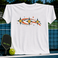 White unisex t-shirt featuring a retro celestial pickleball graphic with earth-toned stars and orbiting balls.