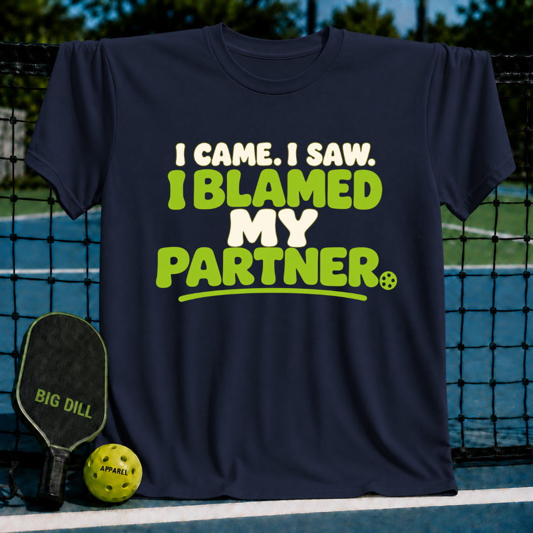 Navy blue crewneck T-shirt featuring the text I Came. I Saw. I Blamed My Partner in lime green and white lettering.