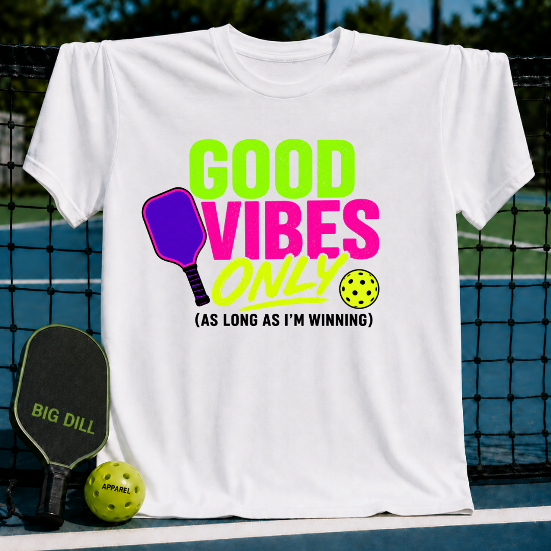 White unisex t-shirt featuring a neon Good Vibes Only pickleball graphic with a paddle and ball on a court background.