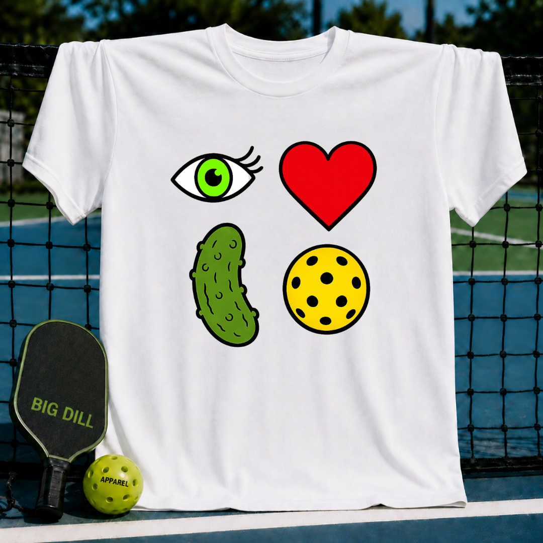 White unisex t-shirt featuring a 2x2 grid of eye, heart, pickle, and ball icons displayed on a pickleball court.
