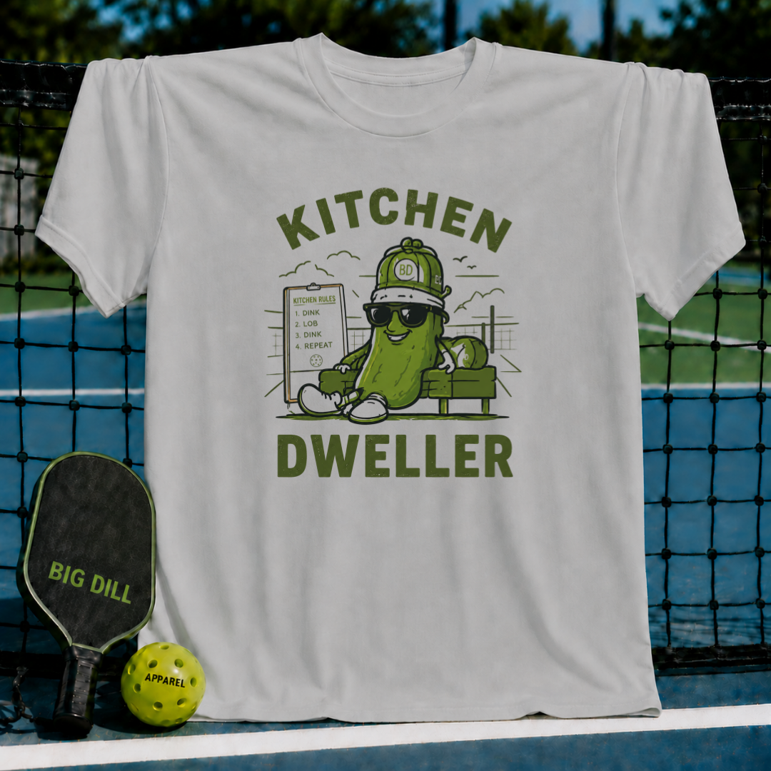 Light gray crewneck T-shirt featuring a pickleball-themed graphic of a cool pickle character with sunglasses.