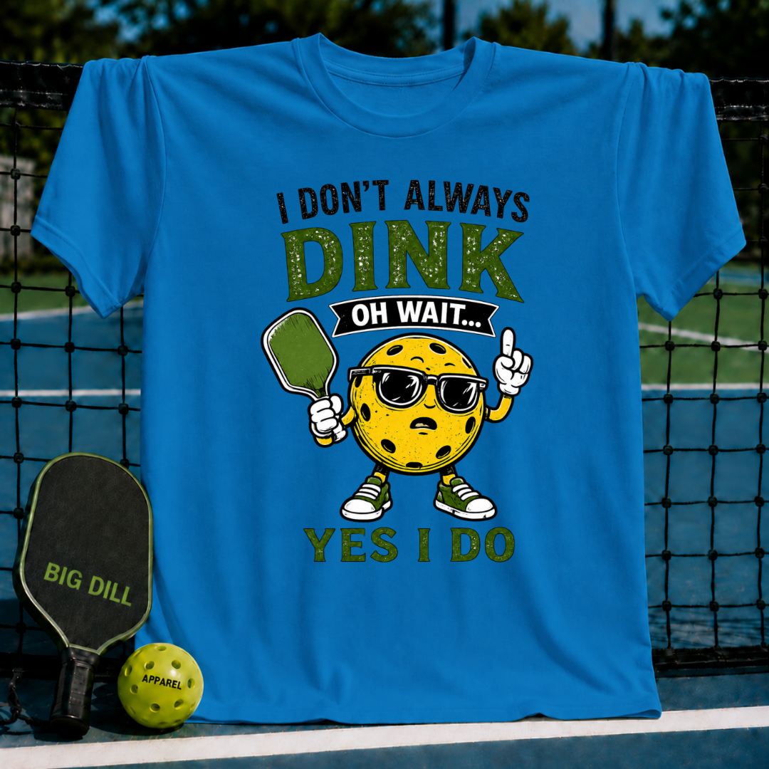 Bright blue crew neck t-shirt featuring a cartoon pickleball character with sunglasses and the text I Don't Always Dink.
