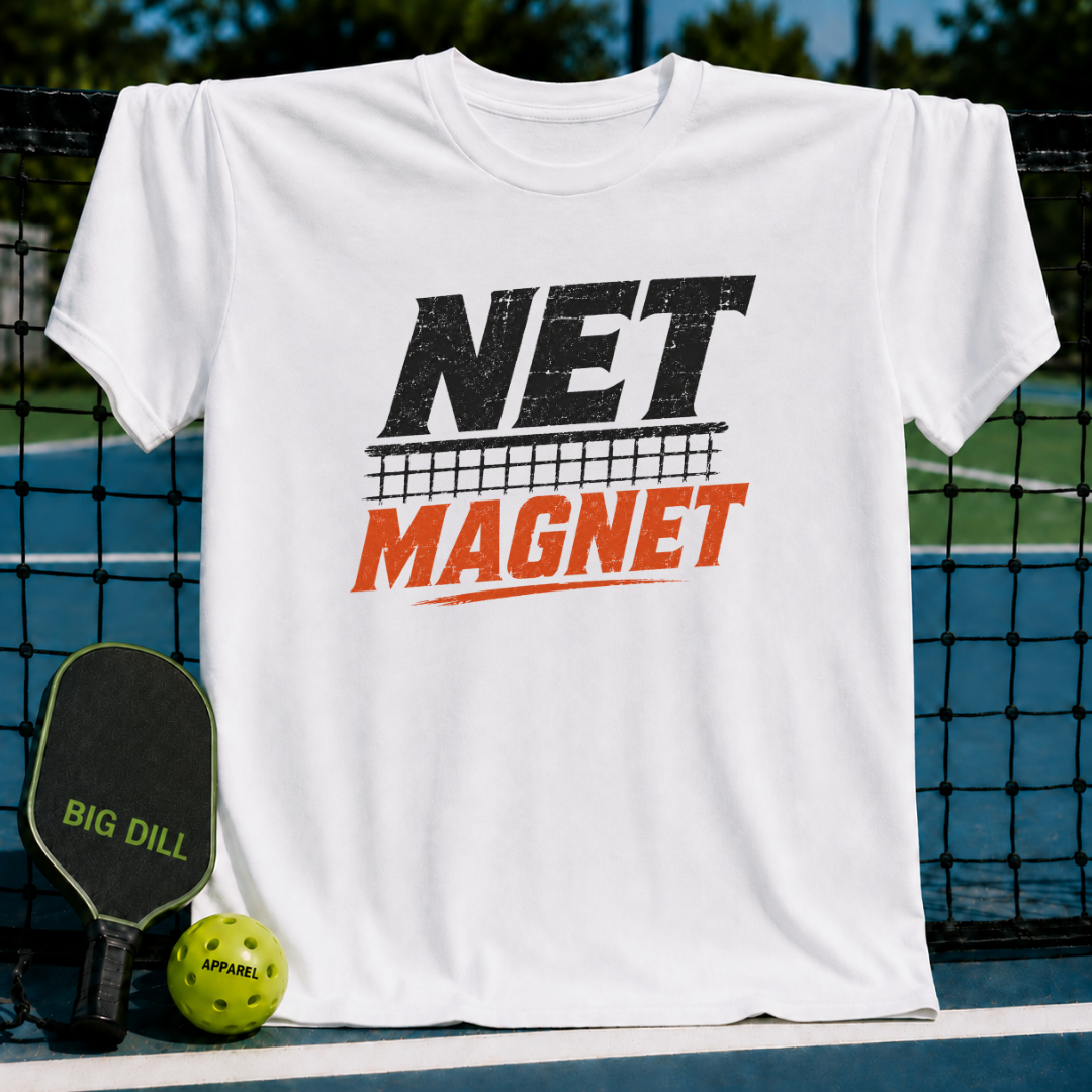 White unisex t-shirt featuring a distressed black and orange Net Magnet pickleball graphic, displayed on a court net.