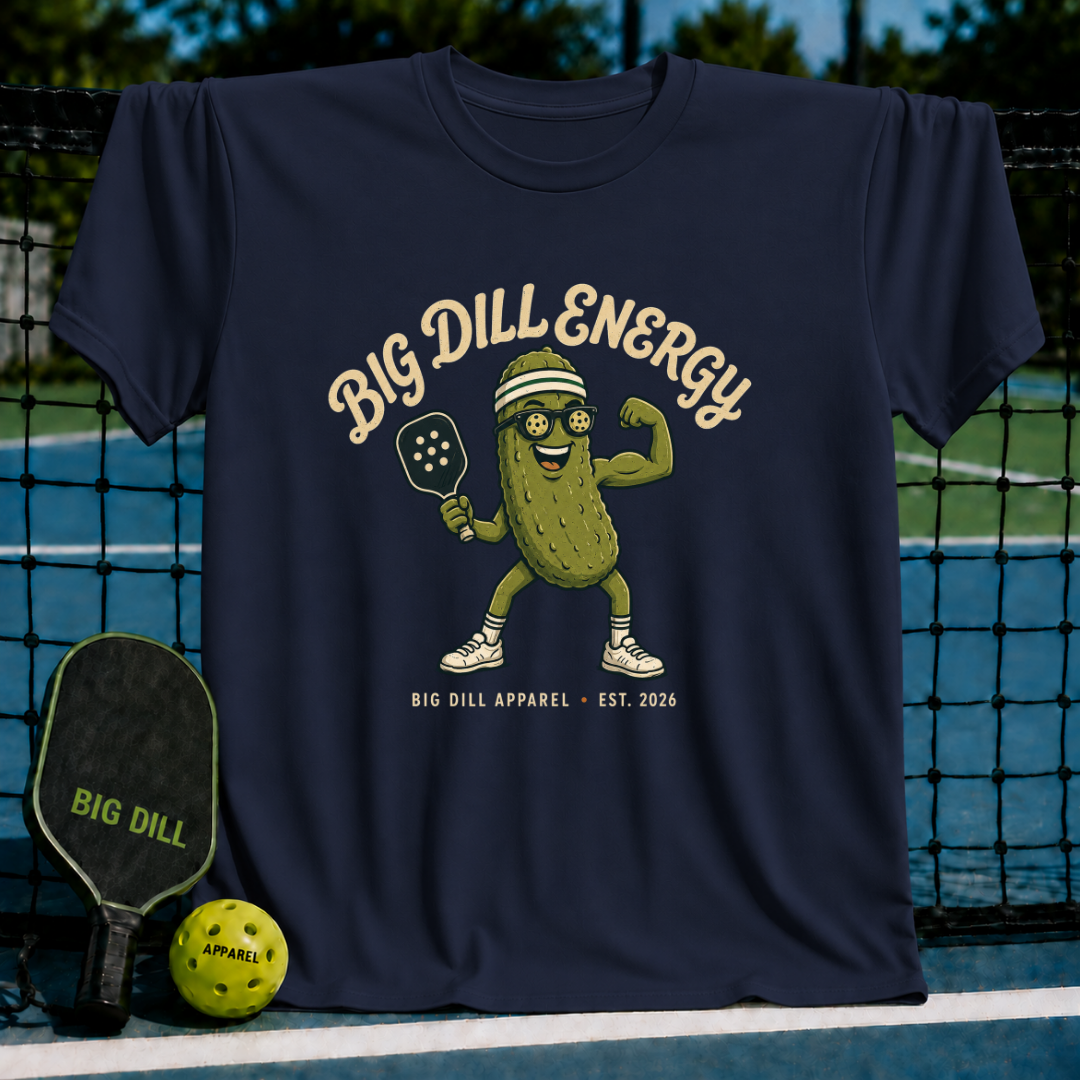 Navy blue unisex t-shirt featuring a pickle mascot with a pickleball paddle, visor, and sunglasses, with Big Dill Energy text.