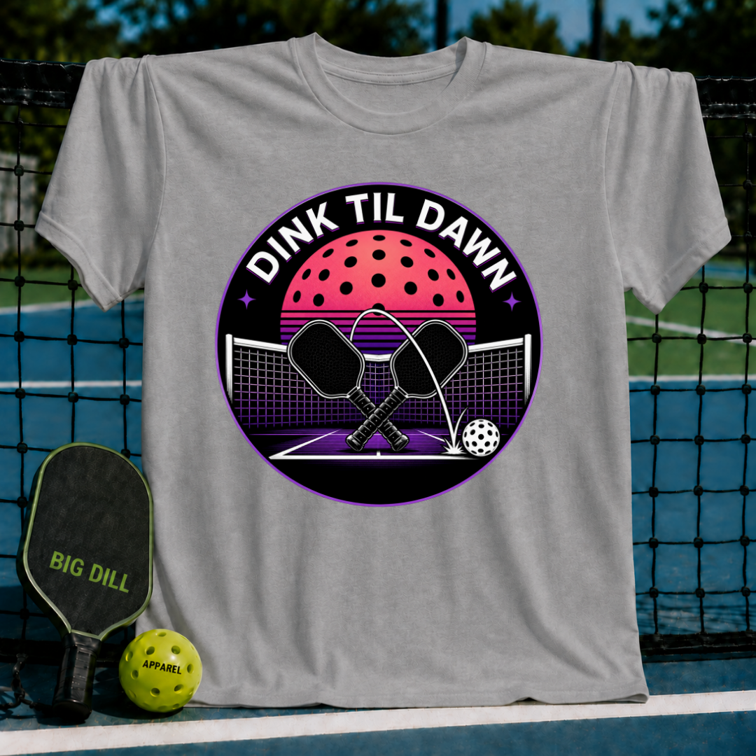 Grey unisex t-shirt featuring a retro synthwave pickleball graphic with crossed paddles and a neon moon design.