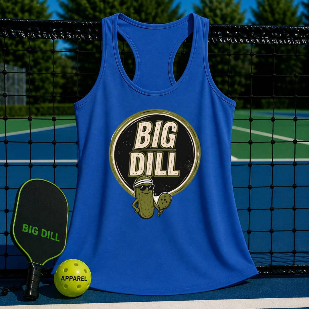 Blue racerback tank top with a retro Big Dill pickle graphic, displayed on a pickleball court with a paddle and ball.