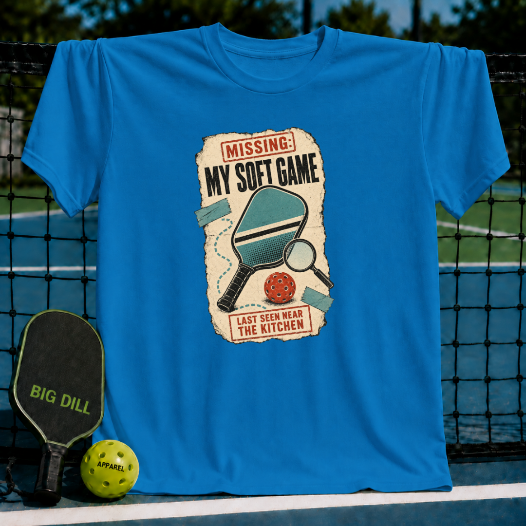 Bright blue crew neck t-shirt featuring a vintage pickleball graphic with a paddle, ball, and Missing My Soft Game text.