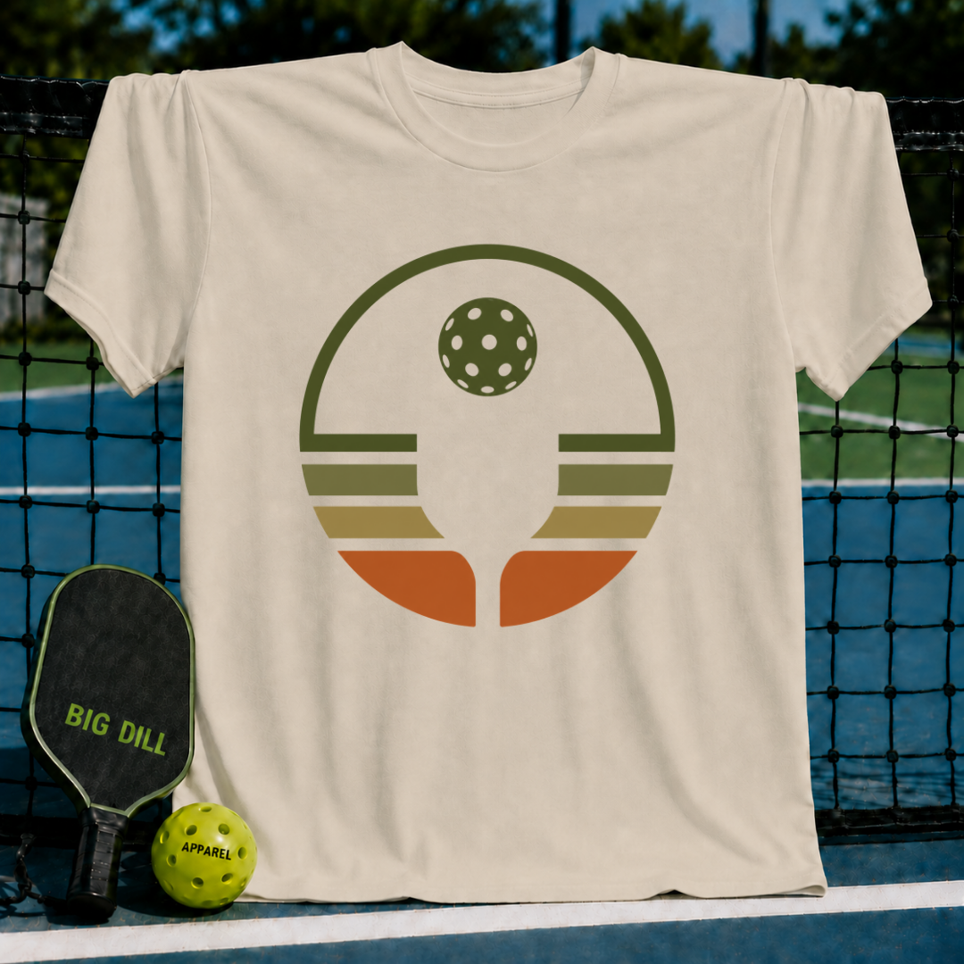 Heather gray unisex t-shirt featuring a retro pickleball circle graphic in olive, rust, and cream earth tones.