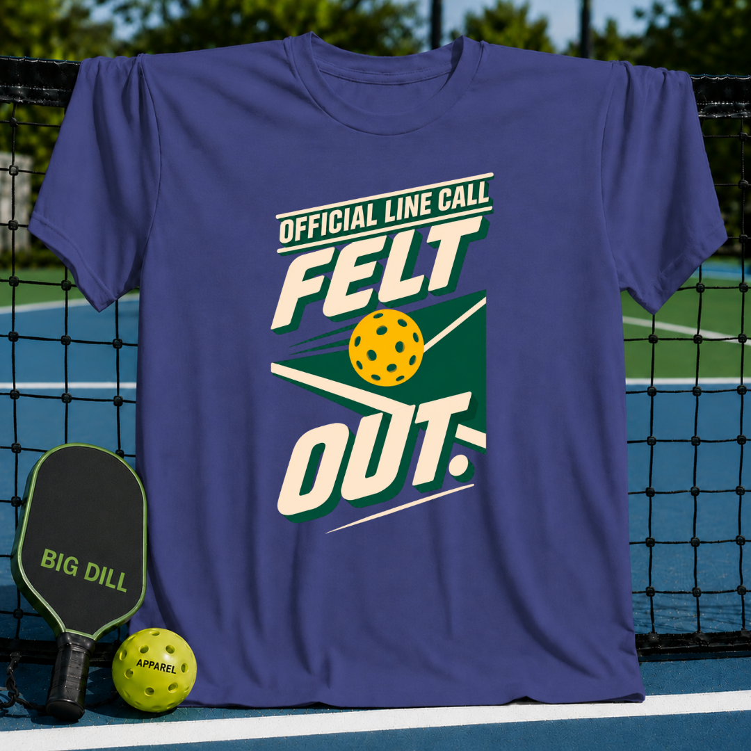 Purple crew neck t-shirt featuring a green and yellow Official Line Call Felt Out pickleball graphic on a court background.
