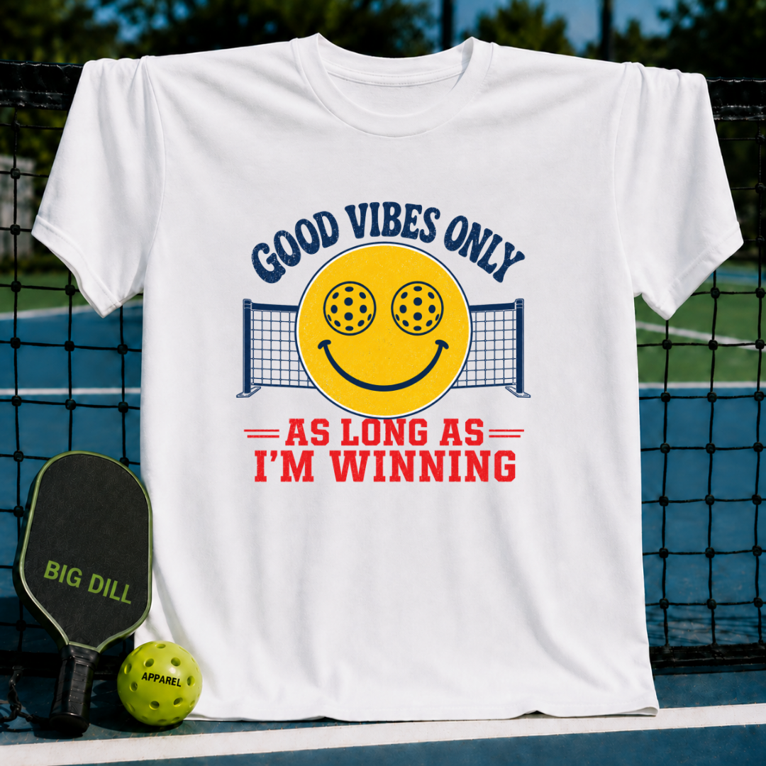 White unisex t-shirt featuring a yellow smiley face with pickleball eyes and a net graphic, with Good Vibes Only text.