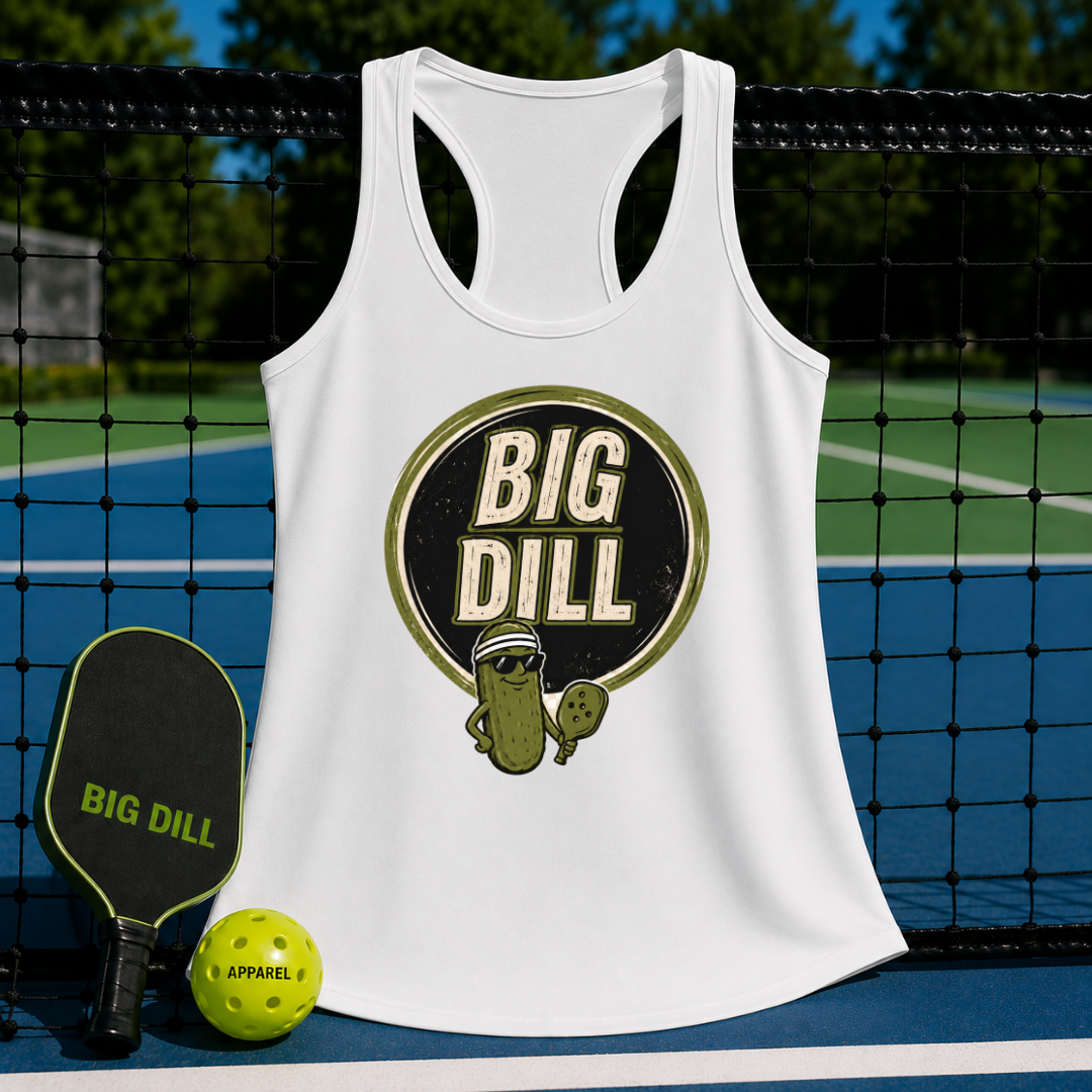 White racerback tank top with a retro Big Dill pickle graphic, displayed on a pickleball court with paddle and ball.