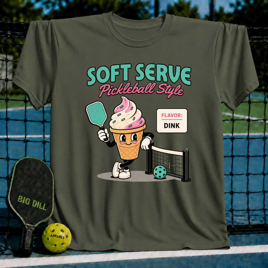 Olive green unisex t-shirt featuring a retro ice cream cone character holding a pickleball paddle on a court.