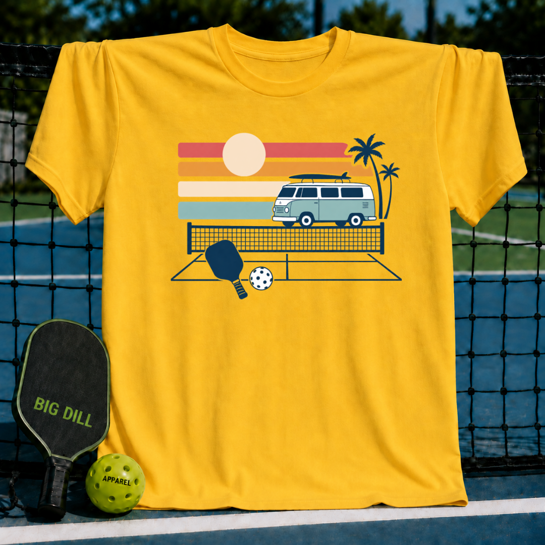 Bright yellow cotton t-shirt featuring a retro van, palm trees, and pickleball court graphic on a court background.