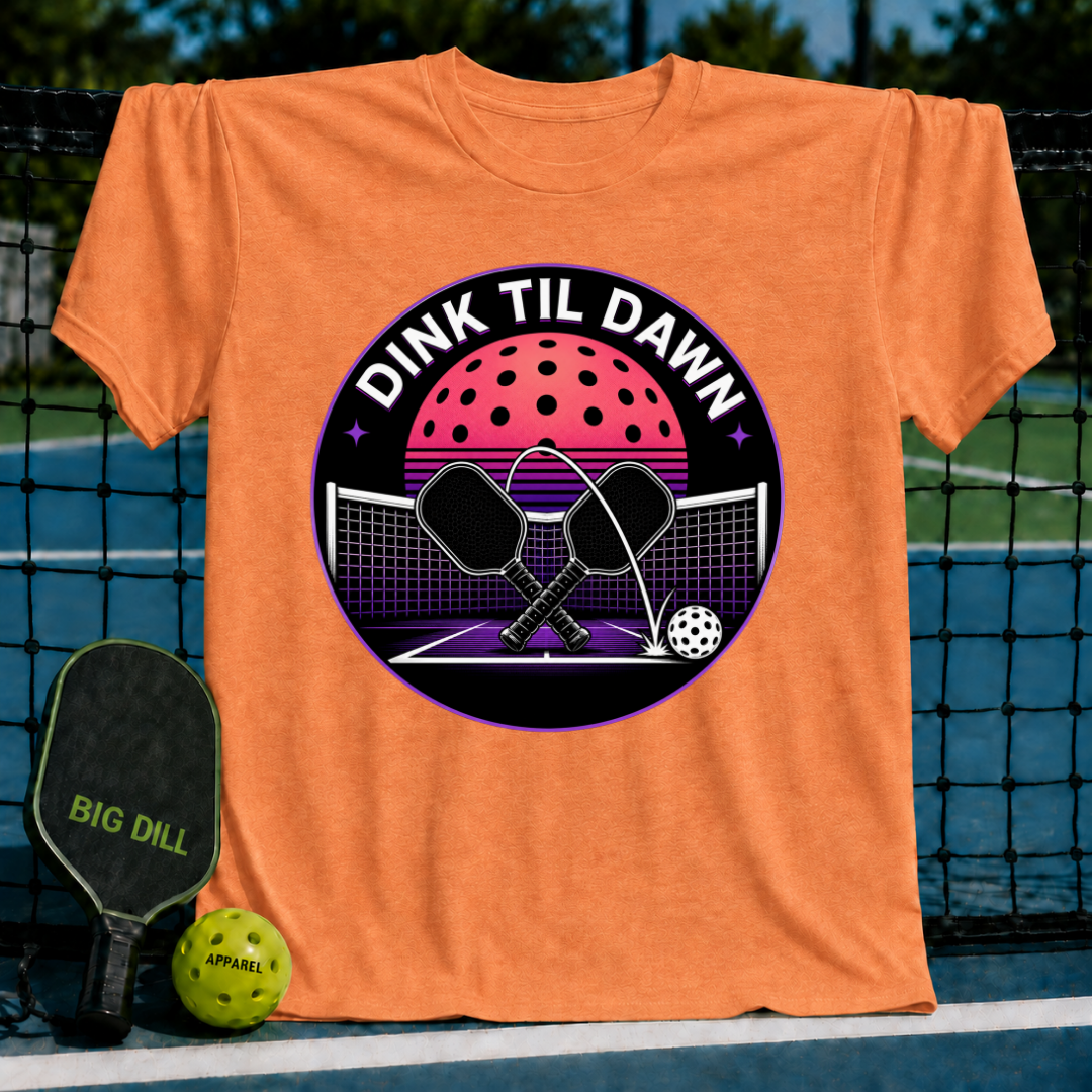 Orange unisex t-shirt featuring a retro synthwave pickleball graphic with crossed paddles and a neon moon on a court.