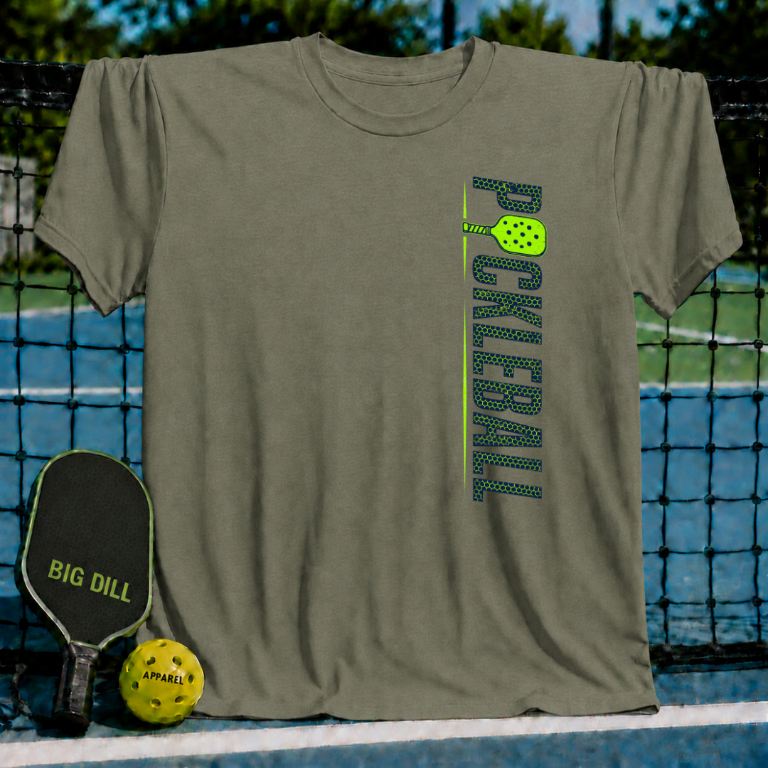 Olive green unisex t-shirt featuring a vertical stacked Pickleball graphic with a neon green paddle on a pickleball court.