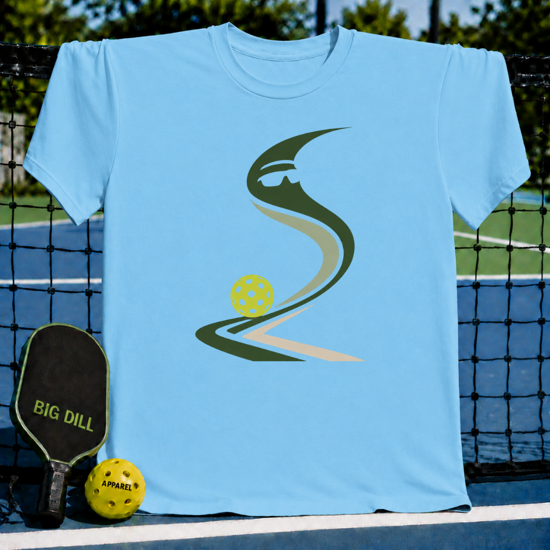 Light blue crewneck t-shirt featuring a stylized green pickleball graphic on a pickleball court background.