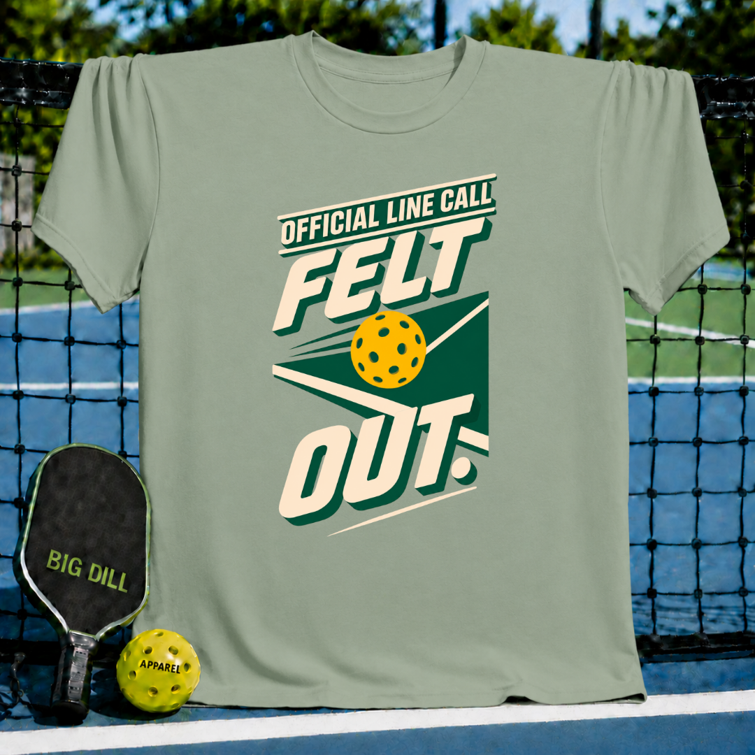 Sage green crewneck t-shirt featuring a pickleball-themed Official Line Call Felt Out graphic on a pickleball court.