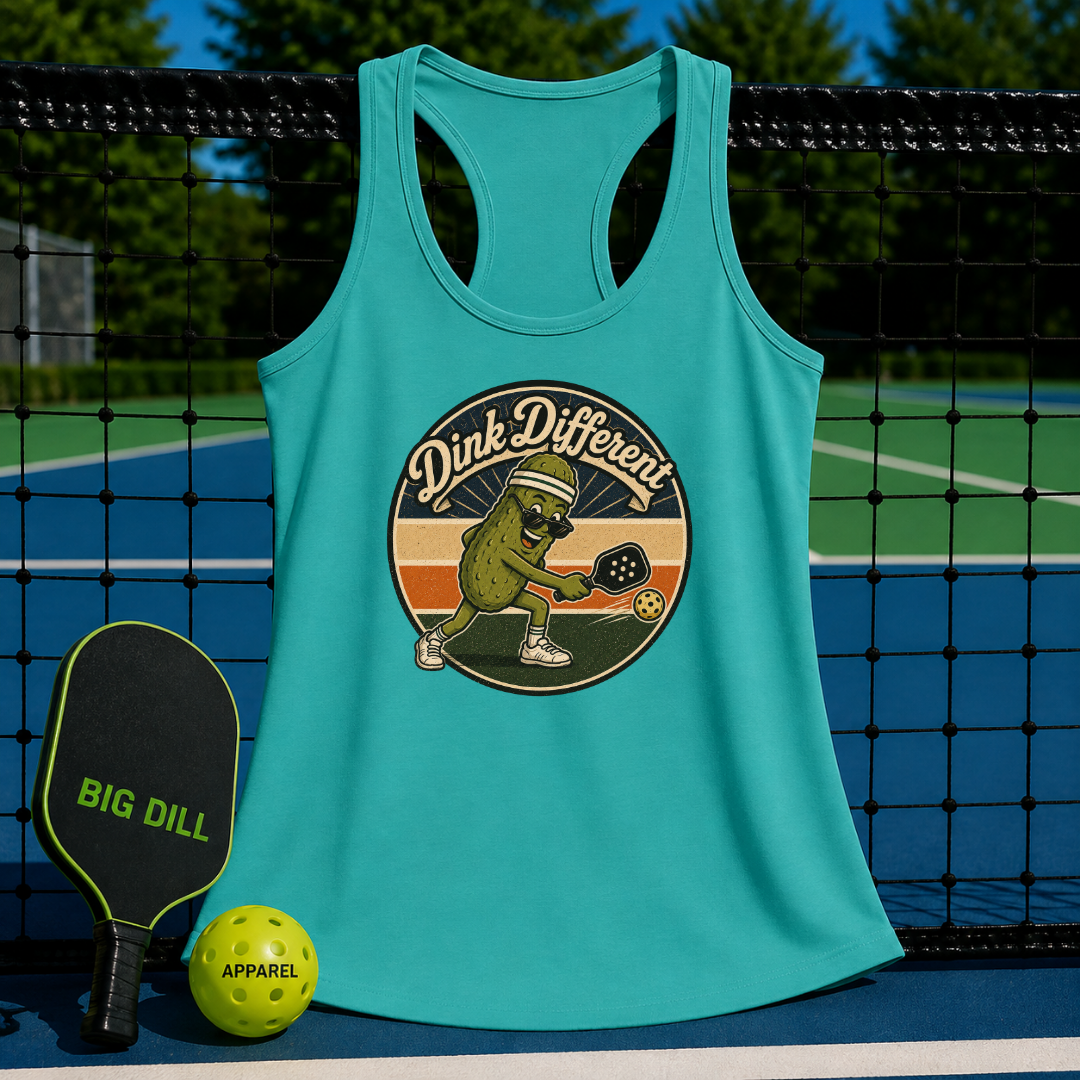 Teal racerback tank with a retro pickleball graphic, featuring a pickle character on a pickleball court background.