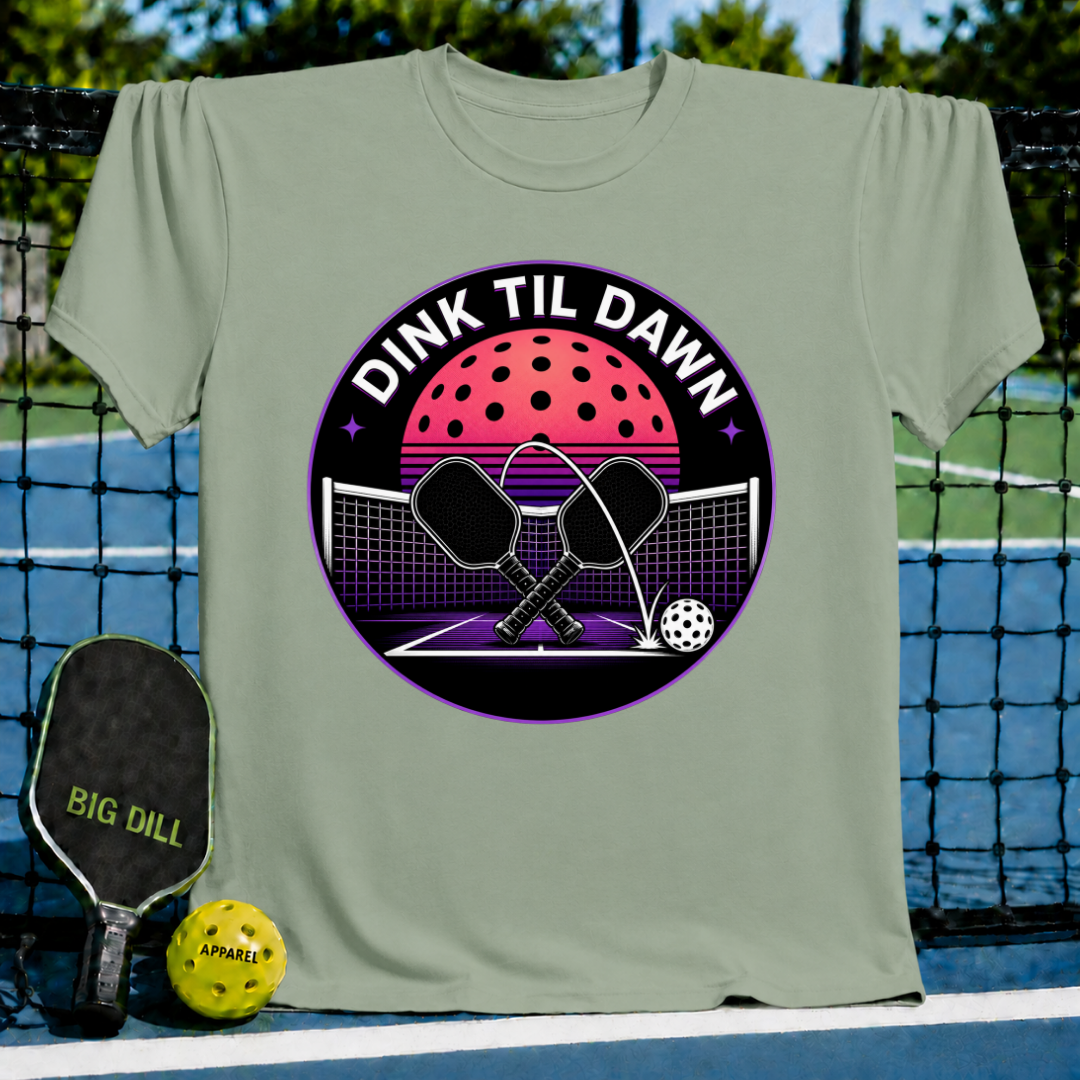 Sage green unisex t-shirt featuring a retro neon pickleball graphic with crossed paddles and a synthwave sunset design.