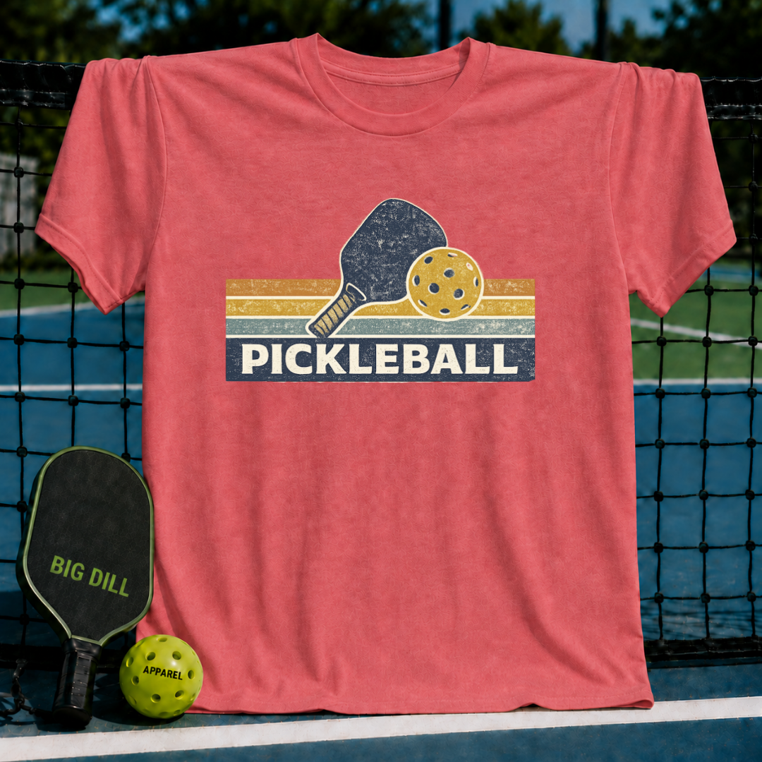 Vintage coral crewneck t-shirt featuring a retro pickleball paddle and ball graphic with striped accents.